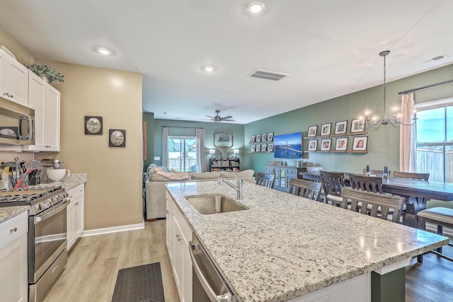 302 Fox Gap Rd, Summerville, SC 29486 - kitchen featuring white cabinets, appliances with stainless steel finishes, a sink, and visible vents