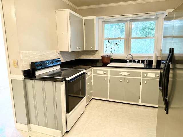 kitchen featuring white electric range, stainless steel fridge with ice dispenser, gray cabinets, and sink