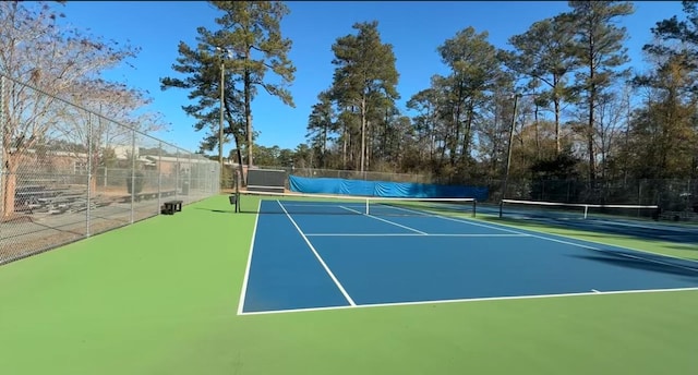 view of sport court featuring basketball hoop