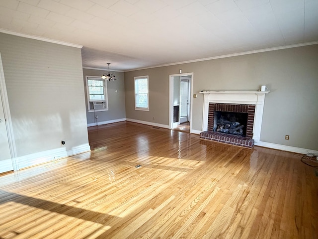 unfurnished living room with crown molding, a fireplace, and wood-type flooring