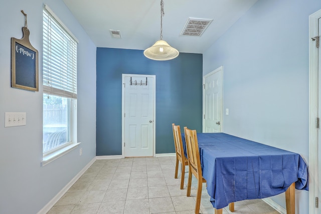dining room featuring visible vents, baseboards, and light tile patterned floors
