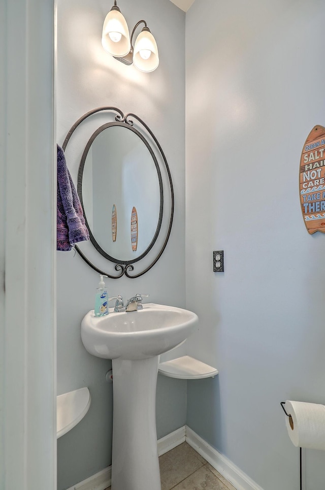 bathroom featuring baseboards and tile patterned flooring