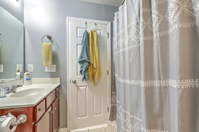 bathroom with tile patterned floors and vanity