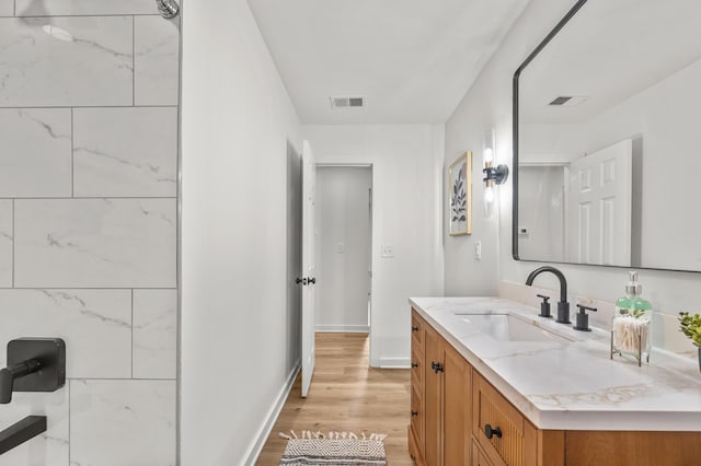 217 Quaker Rd, Saint George, SC 29477 - full bathroom with vanity, wood finished floors, baseboards, and a shower