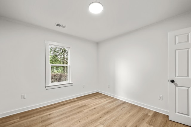 217 Quaker Rd, Saint George, SC 29477 - unfurnished room featuring light wood-style floors, baseboards, and crown molding