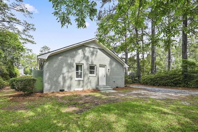 217 Quaker Rd, Saint George, SC 29477 - rear view of house featuring entry steps, brick siding, a yard, and crawl space