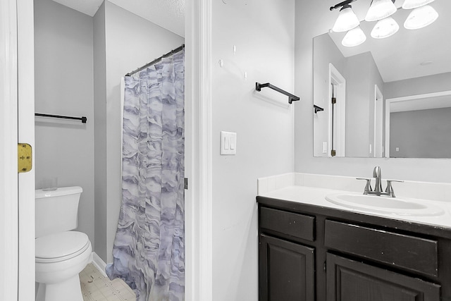 bathroom with a shower with curtain, vanity, and toilet