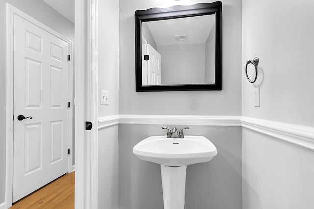 bathroom with hardwood / wood-style flooring