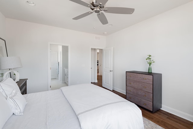 bedroom with connected bathroom, ceiling fan, and dark hardwood / wood-style flooring