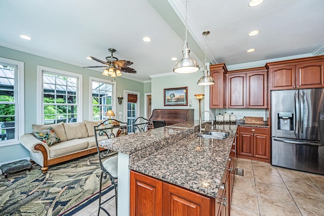 544 Two Mile Run, Johns Island, SC 29455 - kitchen with stainless steel refrigerator with ice dispenser, a kitchen bar, ornamental molding, plenty of natural light, and recessed lighting
