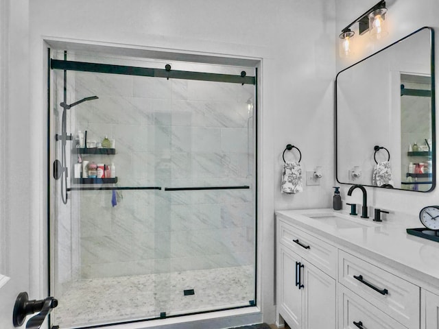 bathroom with vanity and walk in shower