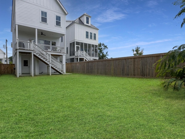 view of yard featuring ceiling fan