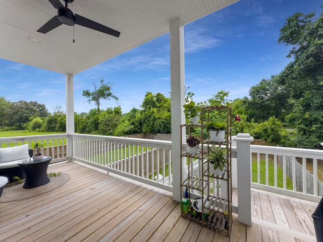 wooden terrace featuring ceiling fan