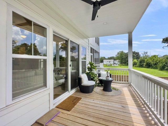 wooden deck with ceiling fan