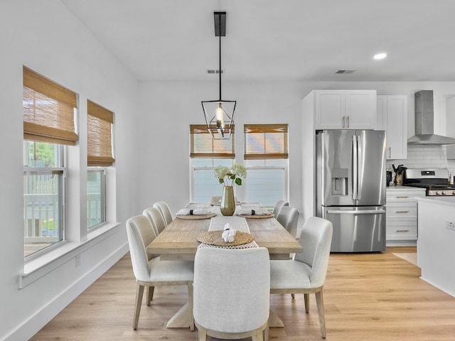 dining area featuring light wood-type flooring