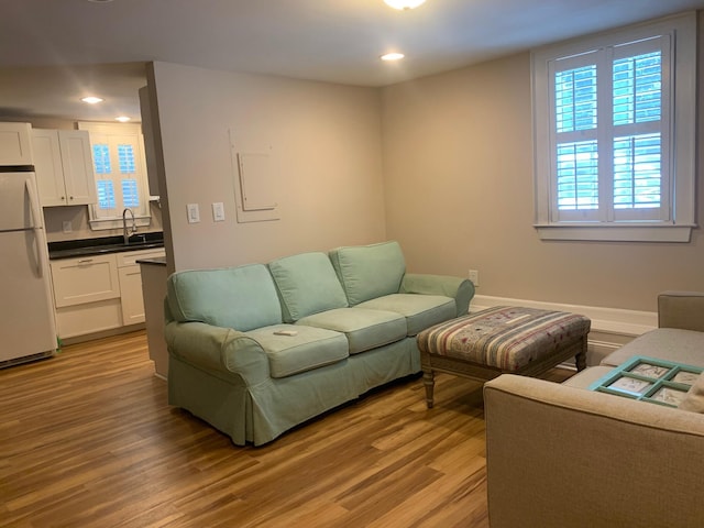65 Vanderhorst St Unit C, Charleston, SC 29403 - living room with plenty of natural light, light wood finished floors, and recessed lighting