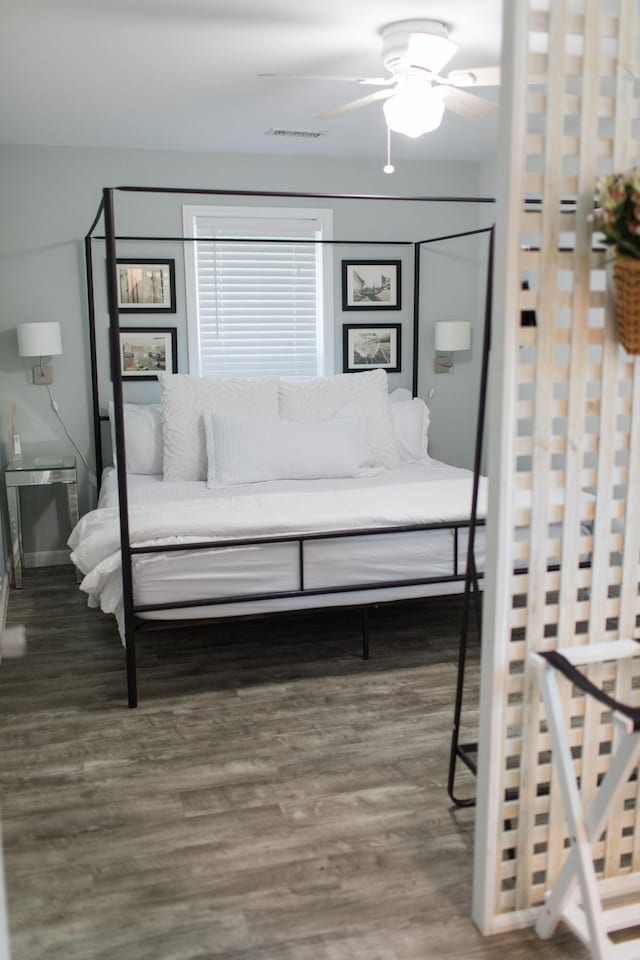 bedroom featuring ceiling fan and wood-type flooring