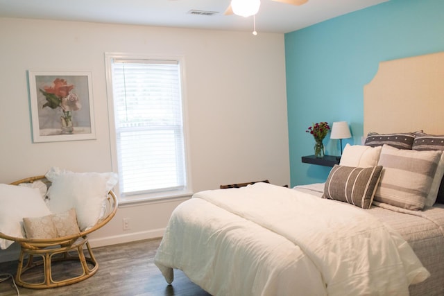 bedroom with wood-type flooring and ceiling fan