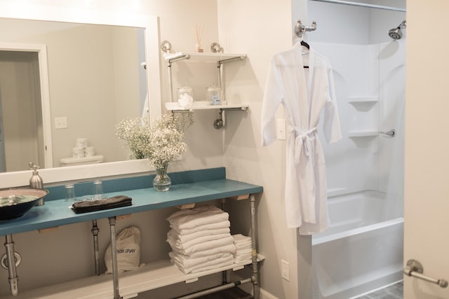 full bathroom featuring bathing tub / shower combination, sink, and toilet