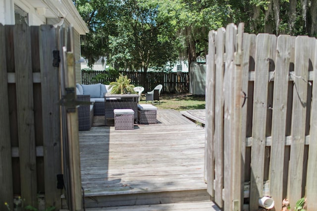 wooden deck featuring an outdoor living space