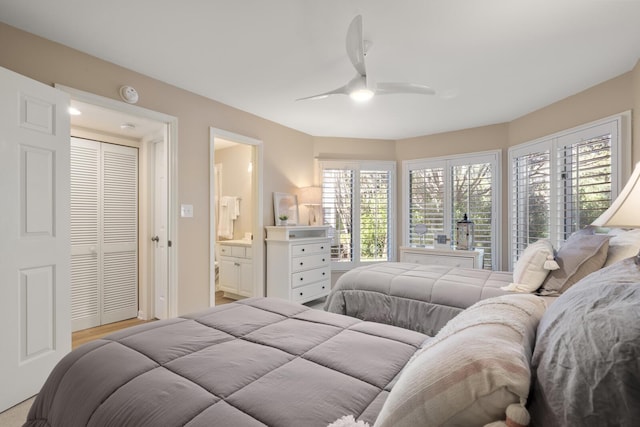 bedroom with ceiling fan and ensuite bathroom