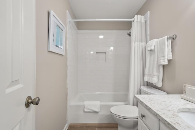 full bathroom with vanity, toilet, and shower / tub combo