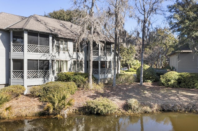 back of house with a water view