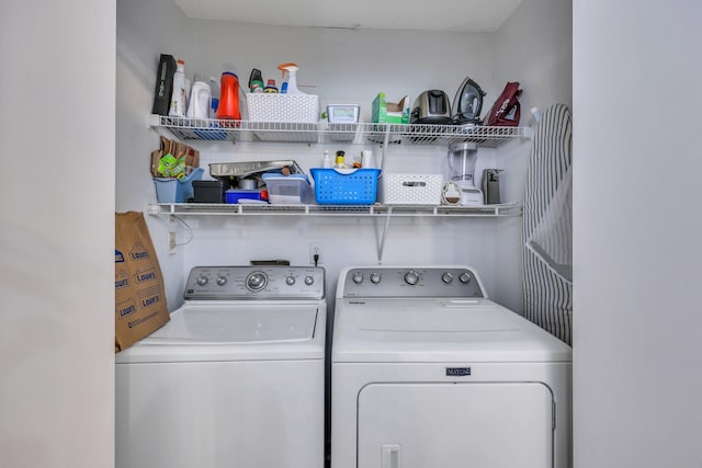 washroom featuring washer and clothes dryer