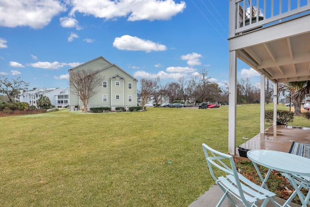 view of yard featuring a balcony