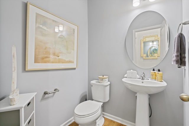 101 Caleb Ct, Ladson, SC 29456 - half bathroom with toilet, baseboards, wood finished floors, and a sink