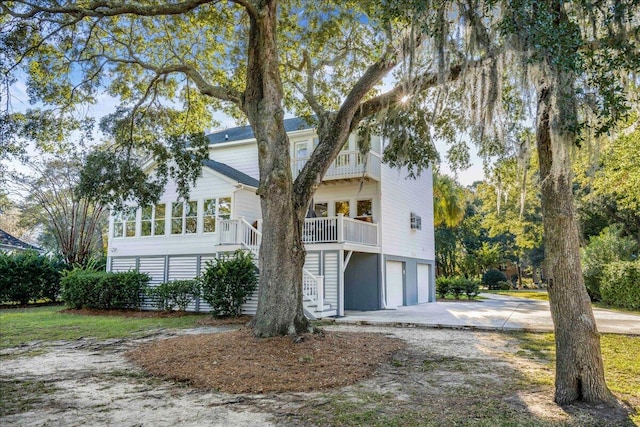 view of front of property featuring a porch and a garage