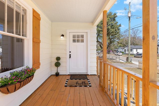 property entrance with covered porch