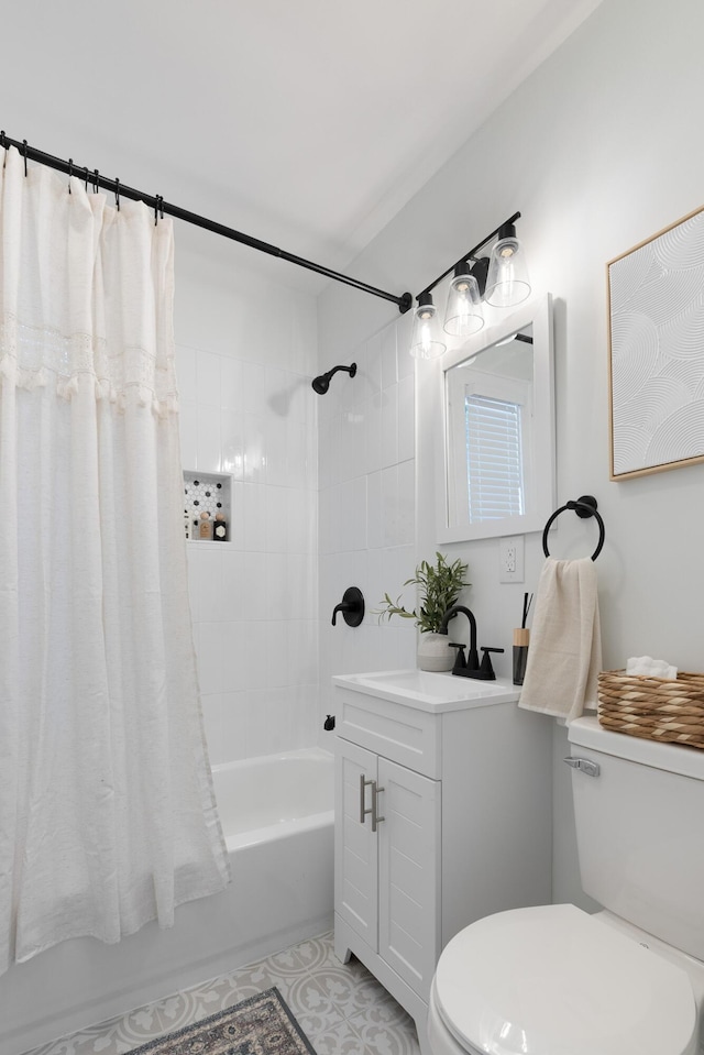 bathroom with tile patterned floors, toilet, vanity, and shower / bath combo