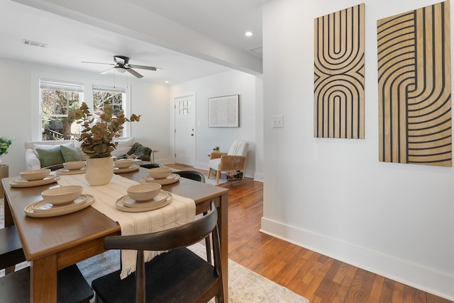 dining area featuring visible vents, a ceiling fan, wood finished floors, recessed lighting, and baseboards