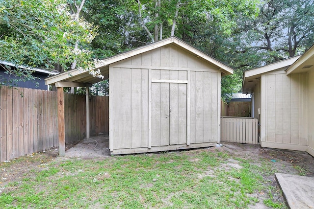 view of shed featuring a fenced backyard