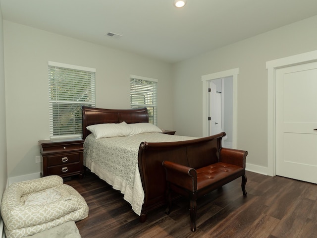 bedroom featuring dark hardwood / wood-style flooring