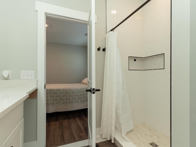 bathroom featuring vanity and curtained shower