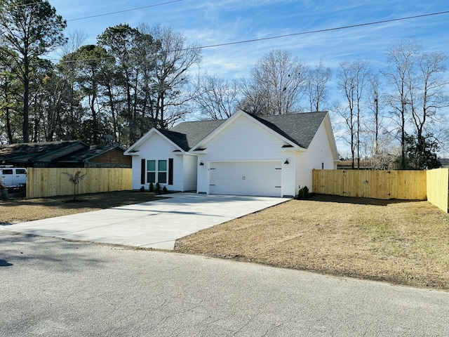 ranch-style house with a front yard and a garage