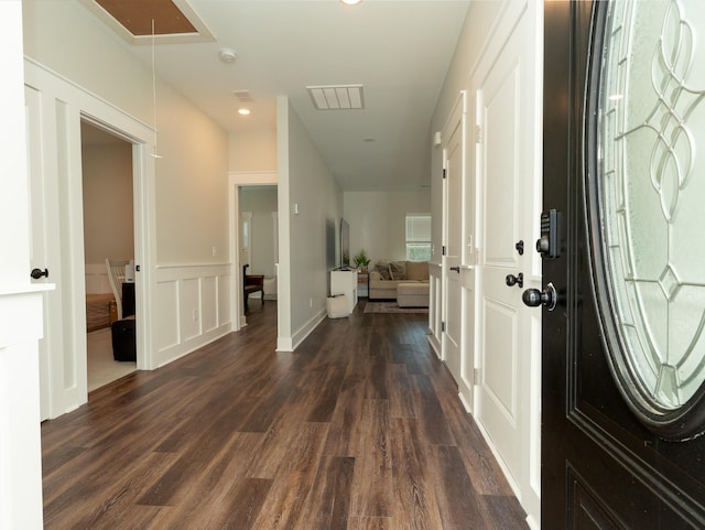 foyer entrance with dark hardwood / wood-style floors