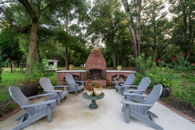 view of patio / terrace featuring an outdoor brick fireplace