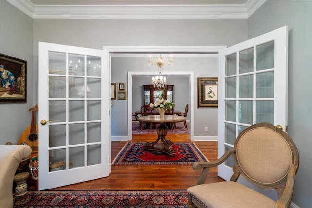 interior space with ornamental molding, french doors, an inviting chandelier, and wood-type flooring