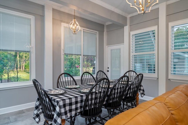 dining space featuring crown molding, an inviting chandelier, and tile patterned floors