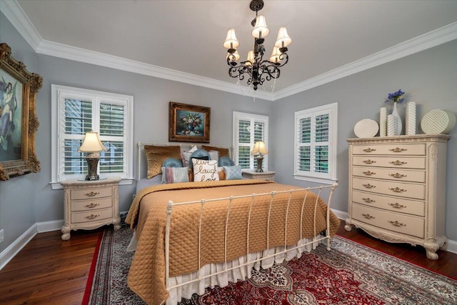 bedroom featuring dark hardwood / wood-style flooring, a chandelier, and ornamental molding