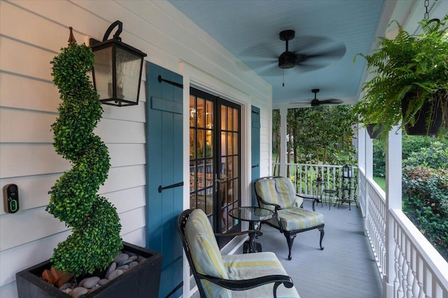 balcony featuring ceiling fan and covered porch