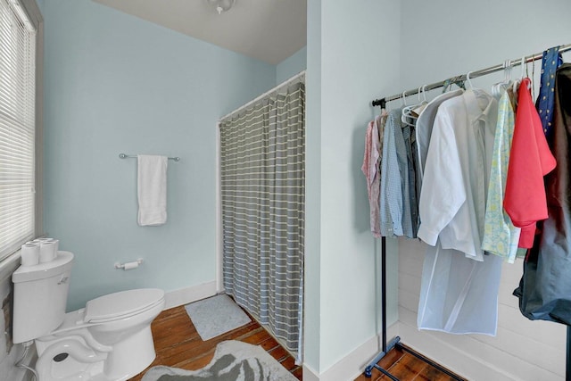 197 Coming St, Charleston, SC 29403 - full bath with toilet, a shower with curtain, wood finished floors, and baseboards