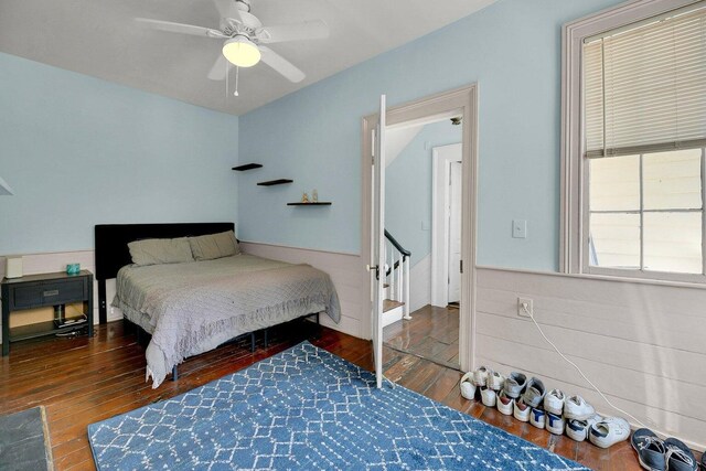 197 Coming St, Charleston, SC 29403 - bedroom with a wainscoted wall, a ceiling fan, and wood-type flooring