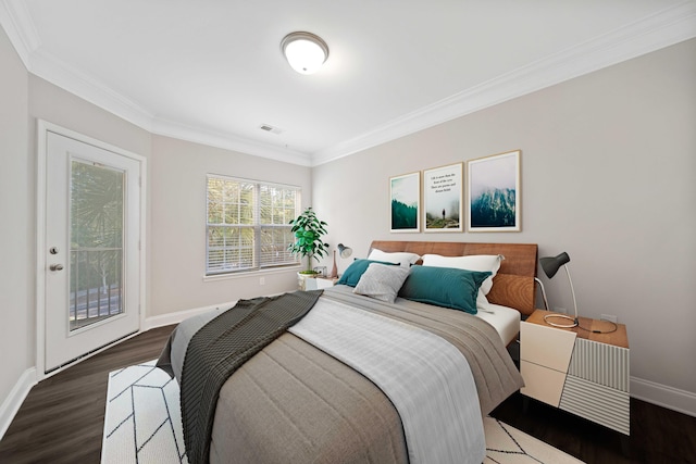 bedroom with dark hardwood / wood-style flooring and ornamental molding