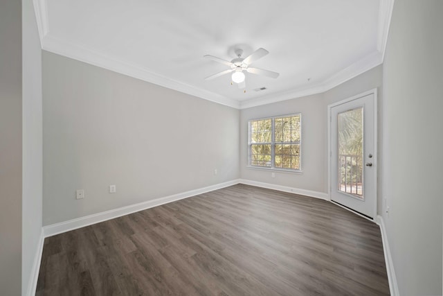 spare room with crown molding, dark hardwood / wood-style flooring, and ceiling fan