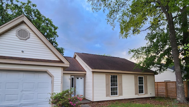315 Indigo Rd, Goose Creek, SC 29445 - view of front facade with a shingled roof, a garage, and fence