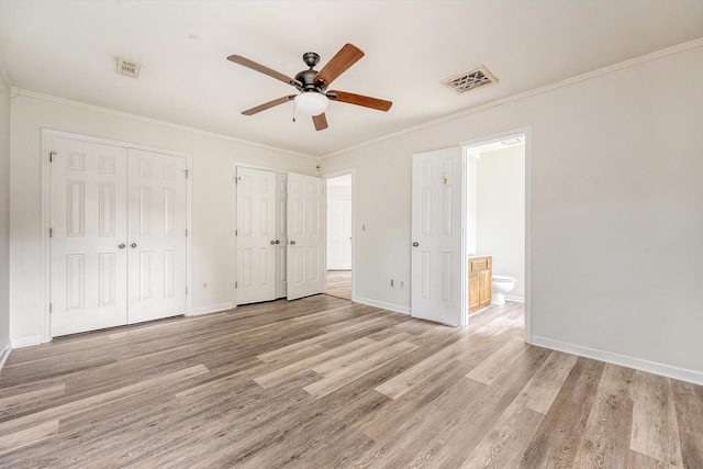 315 Indigo Rd, Goose Creek, SC 29445 - unfurnished bedroom with baseboards, multiple closets, visible vents, and light wood-style flooring